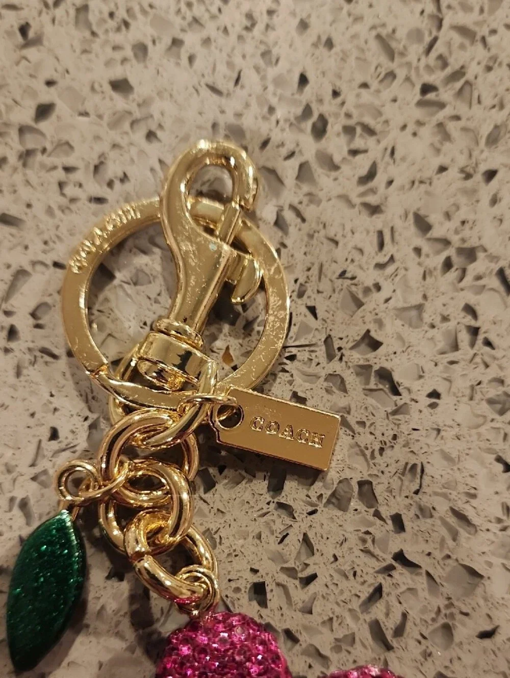 Coach StyleGold-Tone Pink Flower Charm Keyring with Yellow Center and Green Leaf